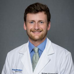 Male Orthopaedic Surgery Resident wearing a white coat