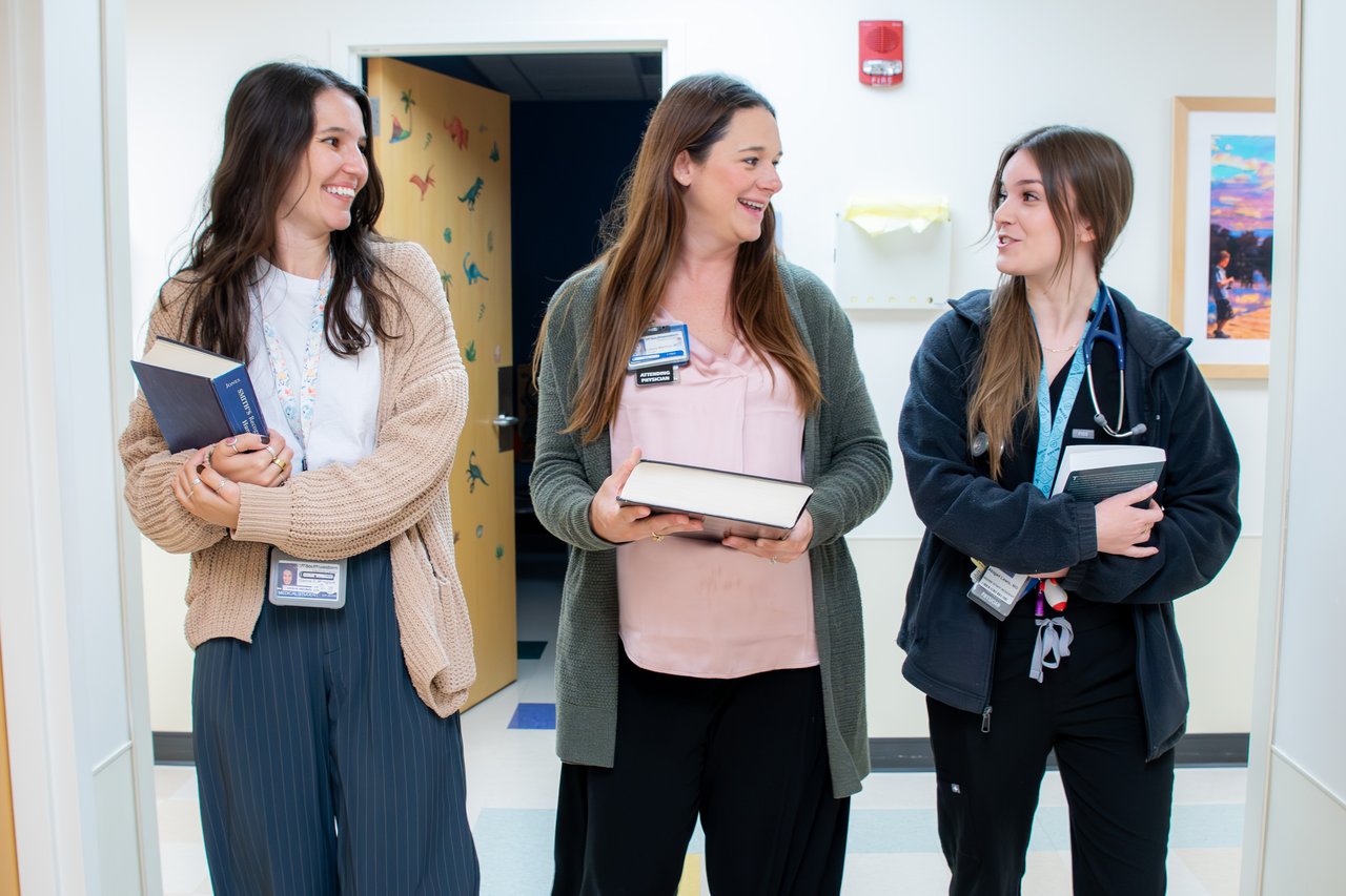 Dr. Mackay walking down a hall, interacting with residents