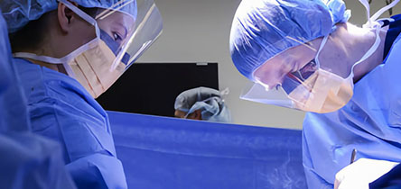 two surgeons in masks