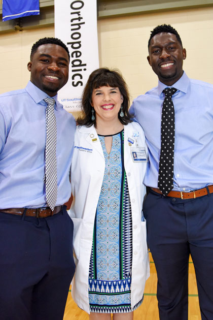 Angelica Mihalic, M.D. with two students on Match Day