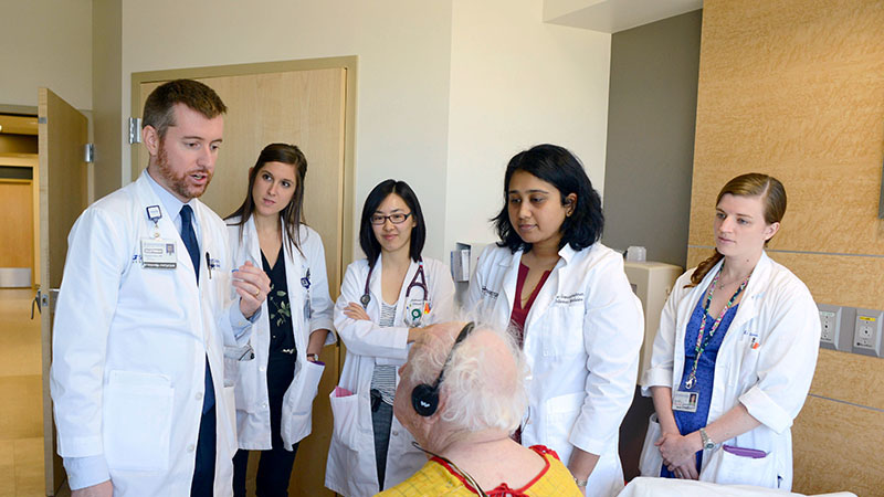 image of Dr. Thomas Dalton with fellows, residents, and students on Eisenberg service