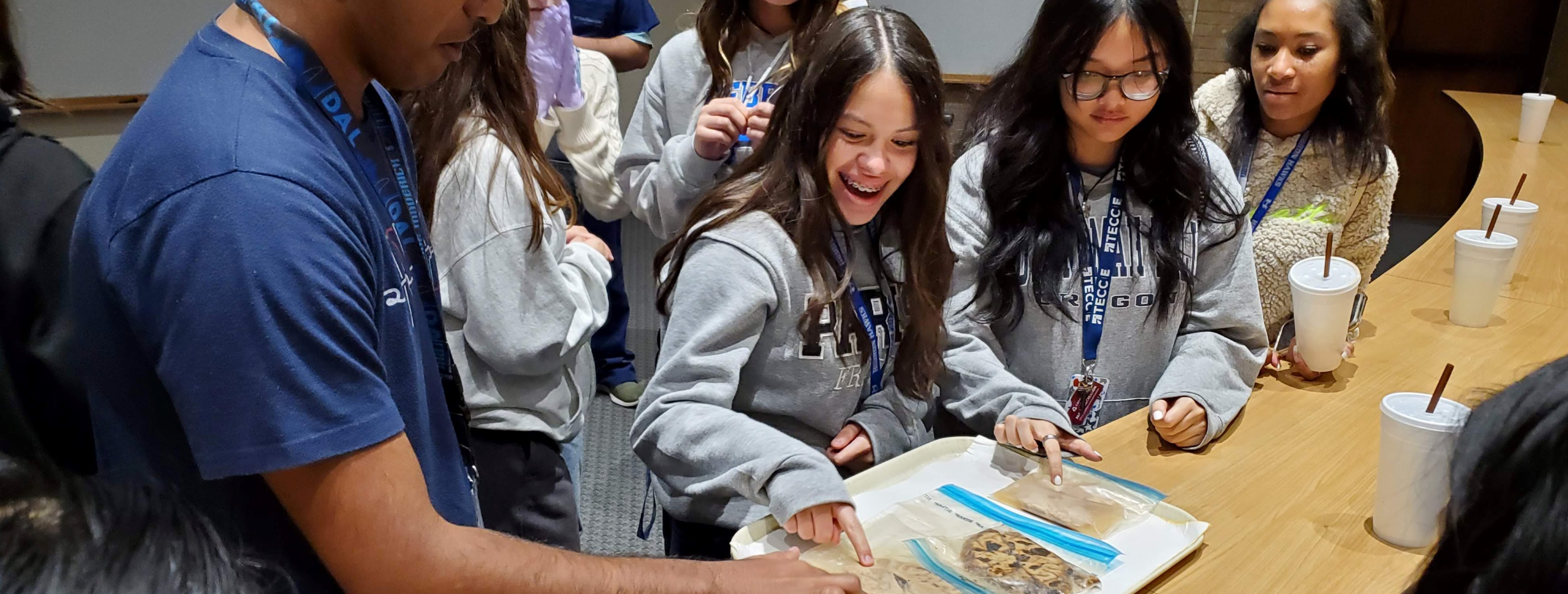 High school students learn about brain histology from neuropathologist Dr. Bret Evers