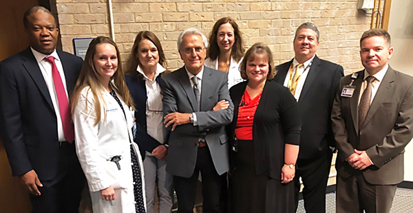 A number of faculty gathered to thank Dr. Sippel for her lecture on thyroid cancer surgery. From left to right: Fiemu Nwariaku, M.D.; Sarah Oltmann, M.D.; Mrs. and Mr. Enrico G. Bartolucci, M.D.; Shelby Holt, M.D.; Rebecca Sippel, M.D.; Herbert J. Zeh, III, M.D.; and Alan Dackiw, M.D.