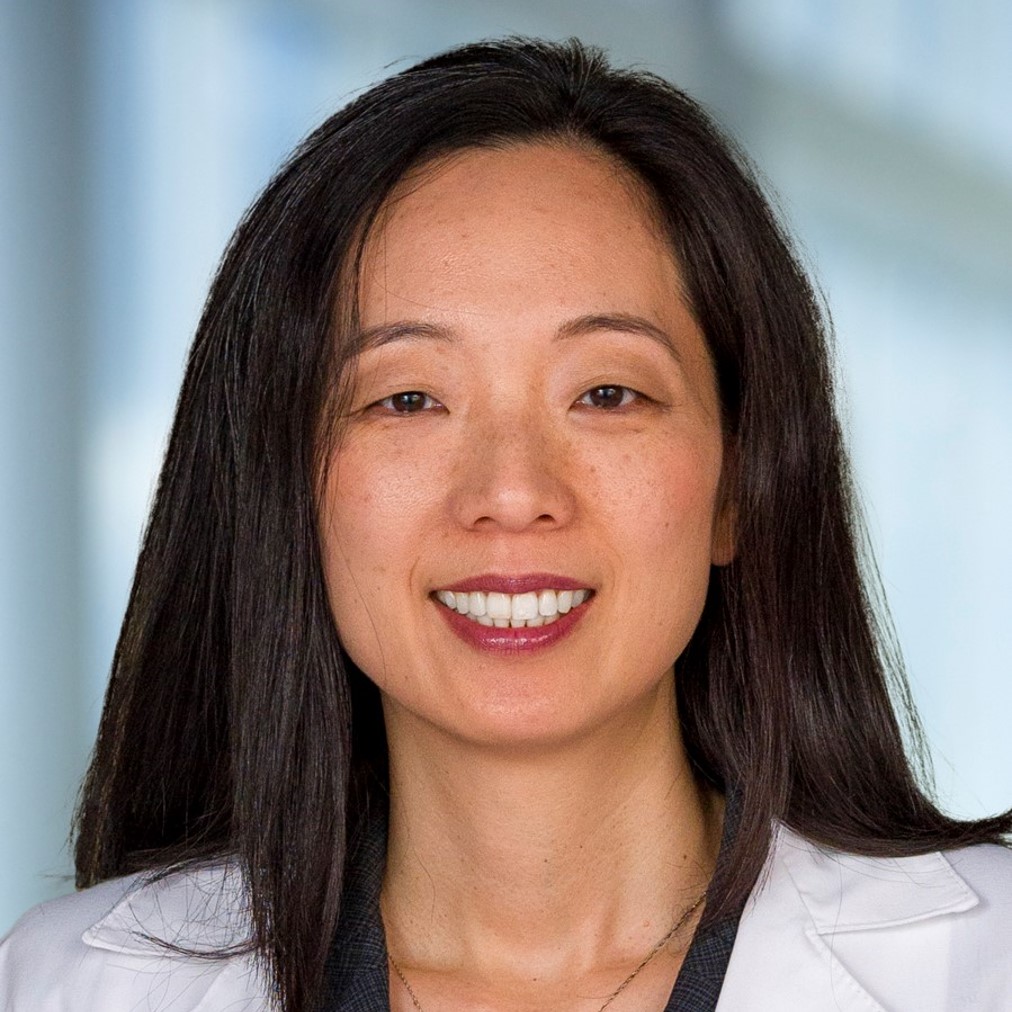 smiling woman with long dark hair