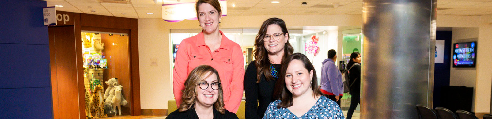 Four woman smiling