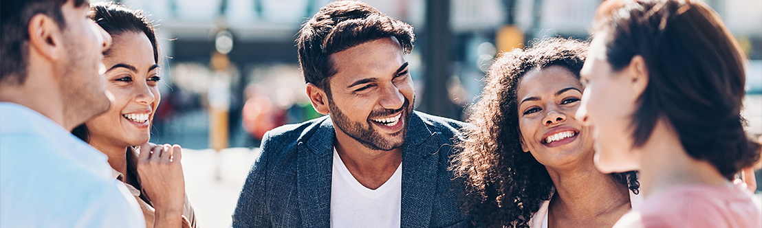 smiling diverse friends greeting each other