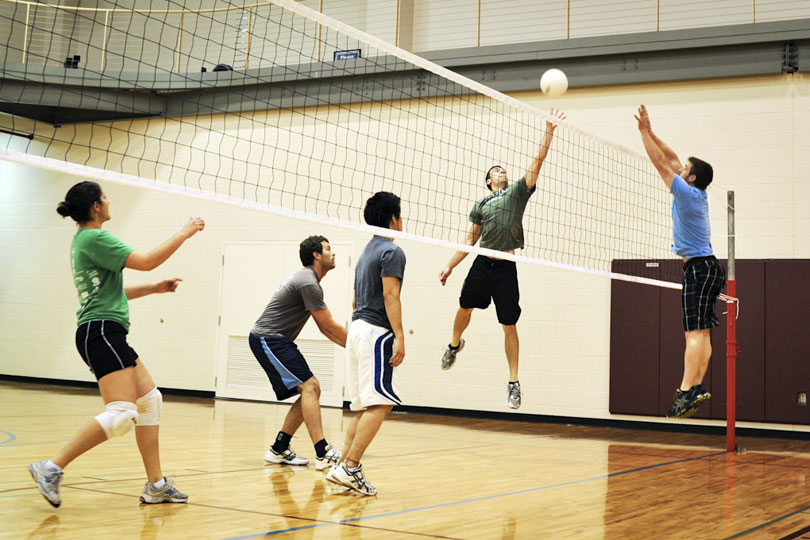 Students play an intramural volleyball game