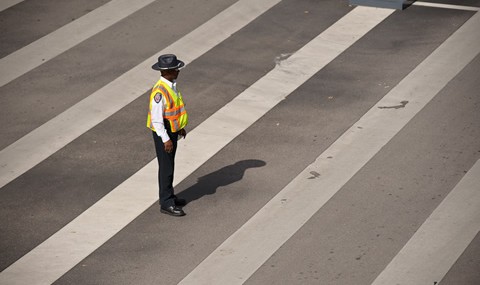 Officer in crosswalk at UT Southwestern.