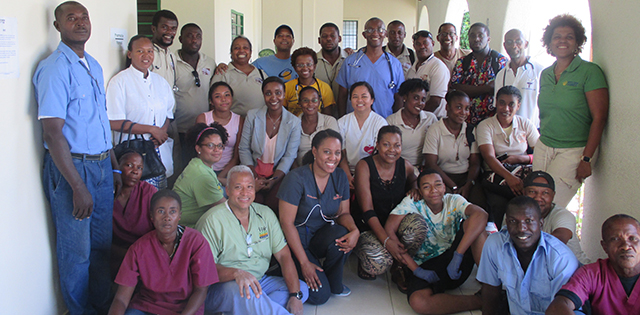 Mr. Adeyemi with other participants and providers outside the clinic in Les Cayes, Haiti, where the mission group worked.