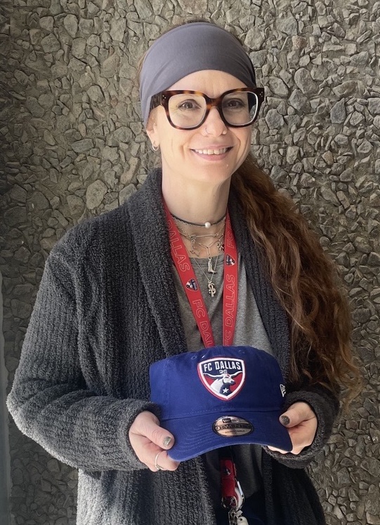 Brooke Shadday, RN, Maternal-Fetal Medicine Clinic holding fcdallas hat