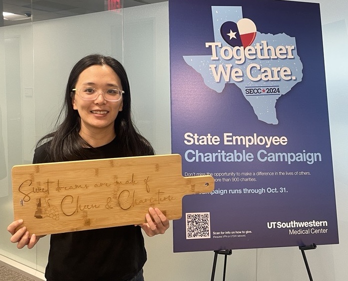 Elaine Wu with cutting board prize